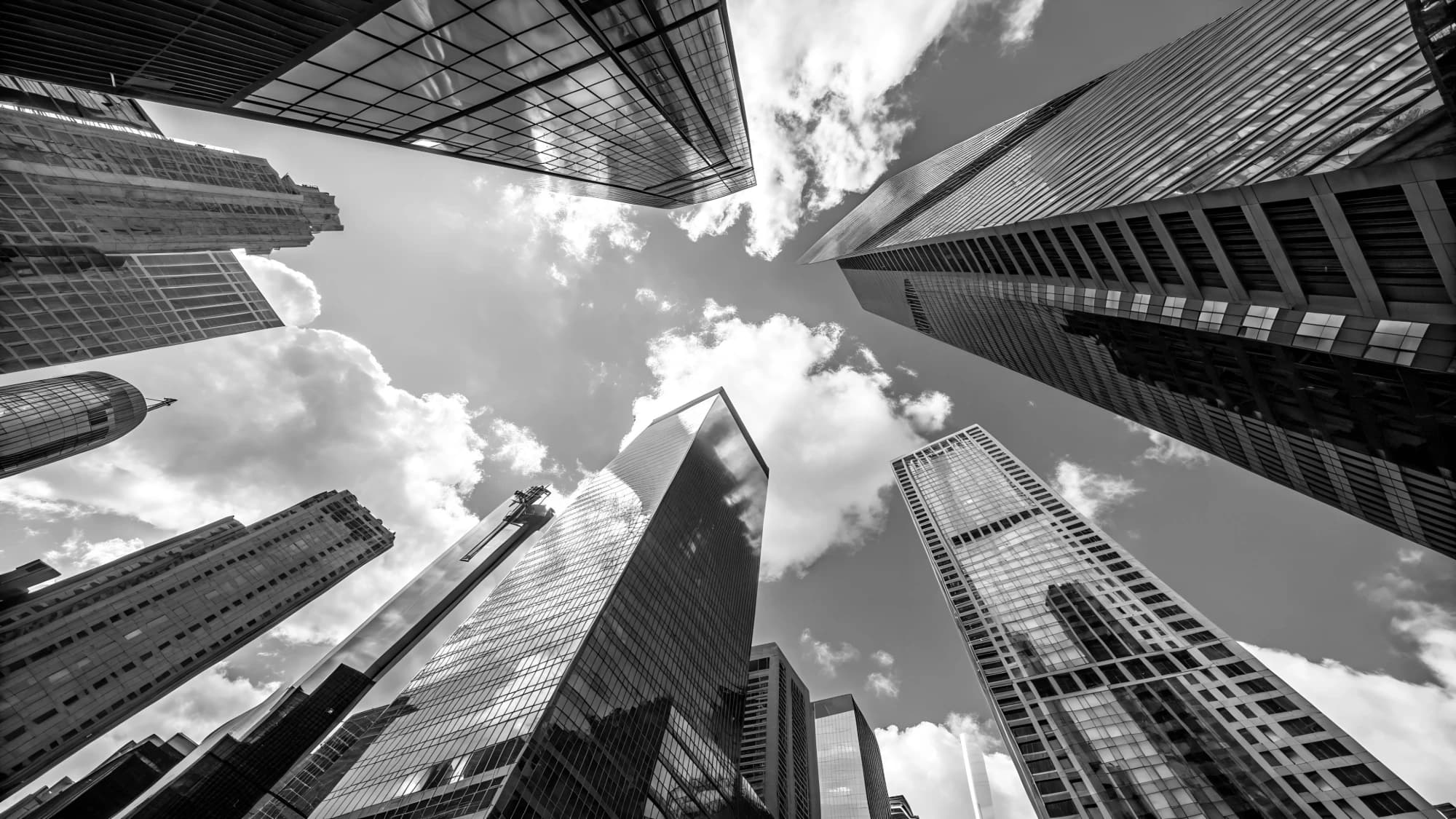 Financial-district towers seen from below, monochrome