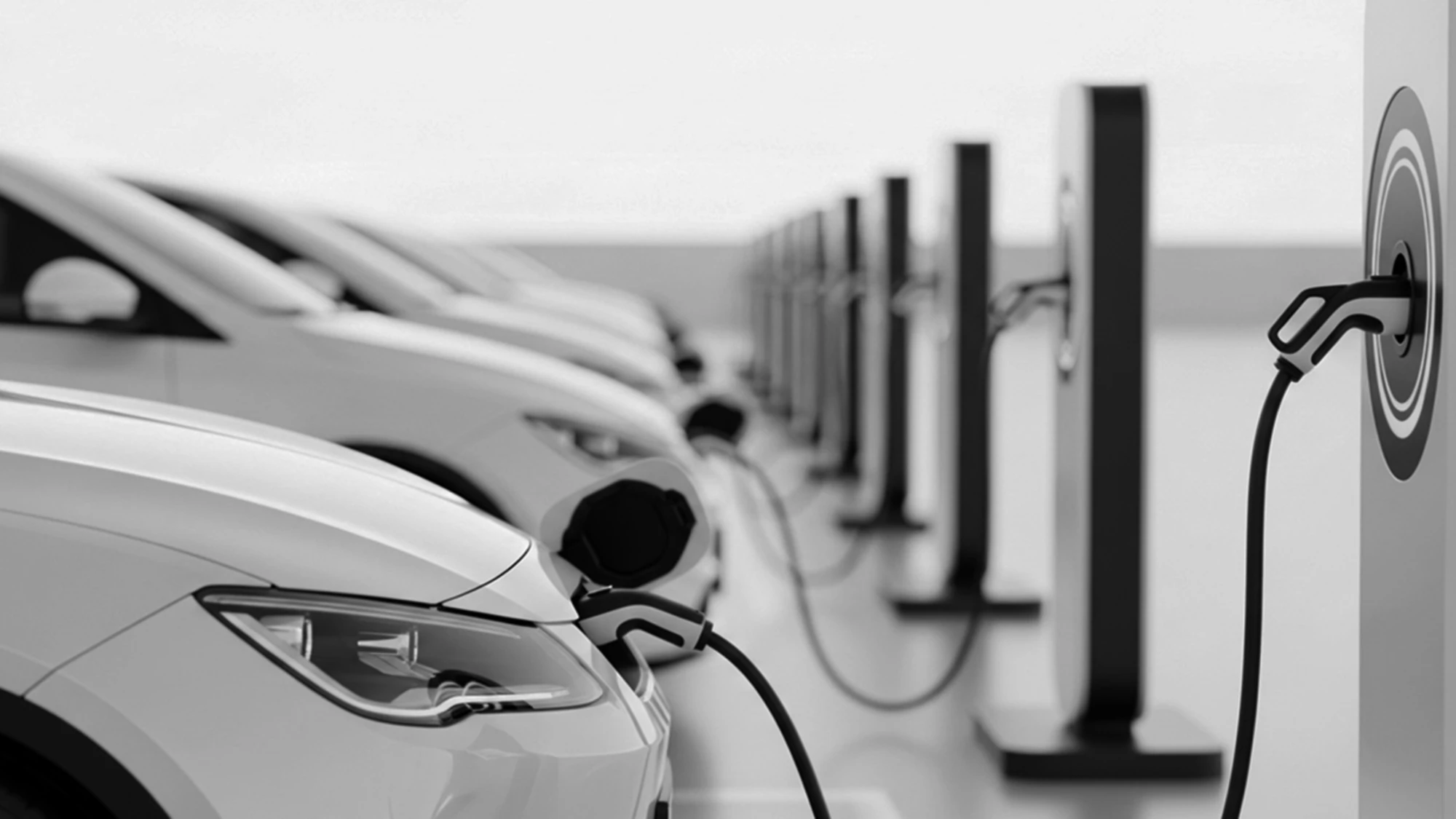 Electric vehicles charging in a row, monochrome