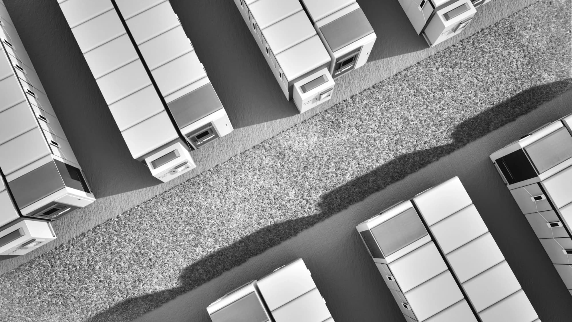Grid-scale battery storage containers, aerial, monochrome